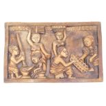 An African tribal style wall hanging heavily carved with many figures, 41cm high, 62cm wide, 3cm dee