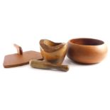 Various treen, yew cake stand with woodpecker handle, 31cm wide, plain bowl, a pestle and mortar (3)