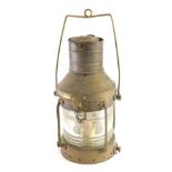 An early 20thC brass ships lantern, with swing handle, textured glazed front, with cylindrical top,