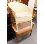 A 1950s/60s fireside chair and a Lloyd Loom type commode chair. The upholstery in this lot does not