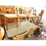 A painted pine refectory style kitchen table, a quantity of beech chairs, and a ladder back chair.