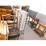 A metamorphic chair/ladder and a folding metal Z bed.