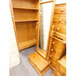 A pine cheval mirror with turned supports and drawer to base.