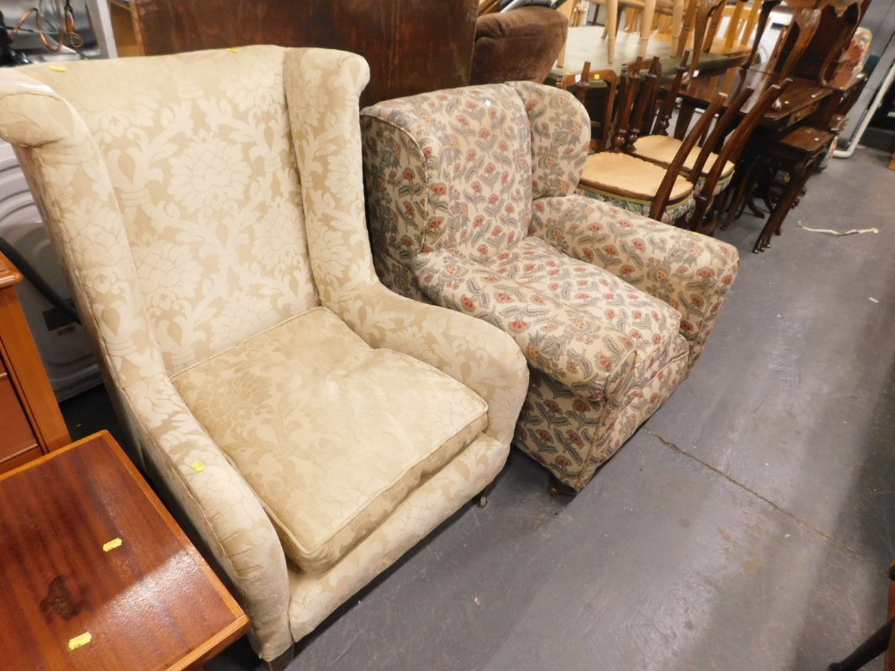 An early 20thC mahogany low wing back chair and an armchair. (2)