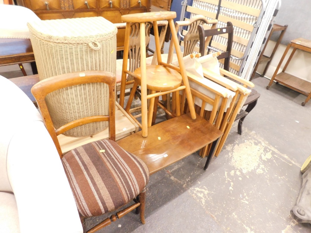 A collection of furniture to include nest of tables, Lloyd Loom linen basket, two pine stools, 1960