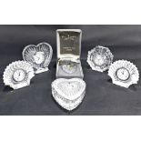 A collection of four Waterford Crystal clocks, to include two shell shaped clocks, heart shaped box
