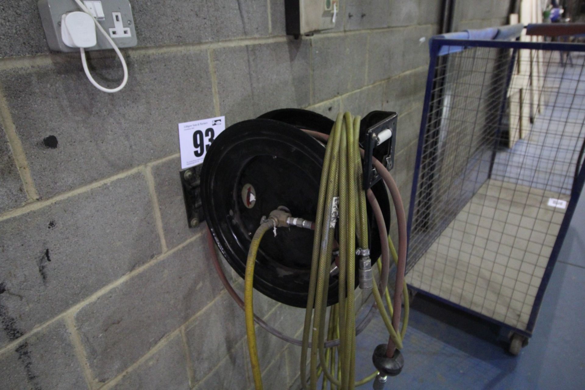 WALL MOUNTED, BLACK AIR LINE SPOOL, AND CONTENTS OF AIR LINE