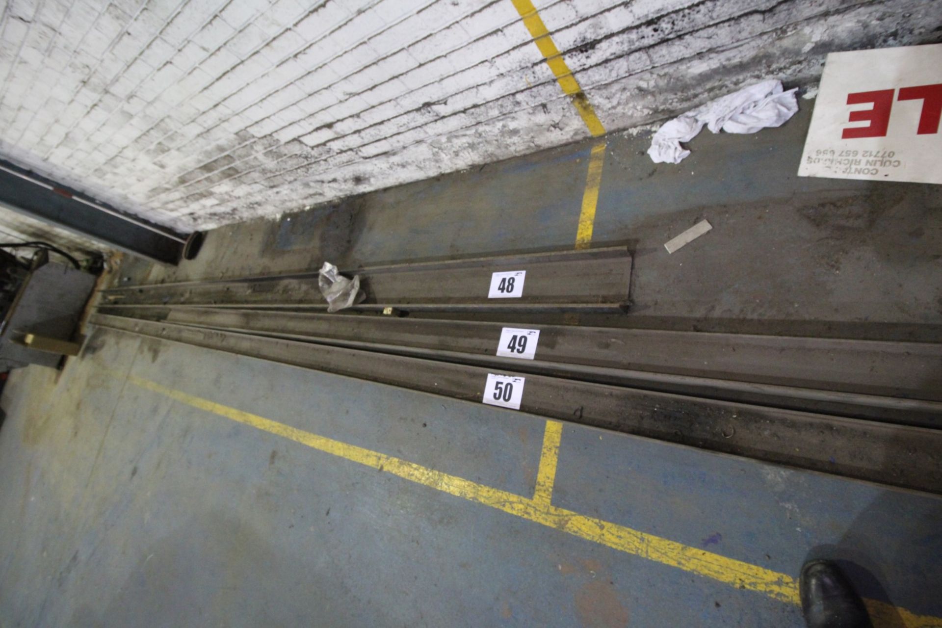 LENGTH OF HEAVY STEEL CHANNEL, MEASURING APPROXIMATELY 8" x 2.75" x 20'