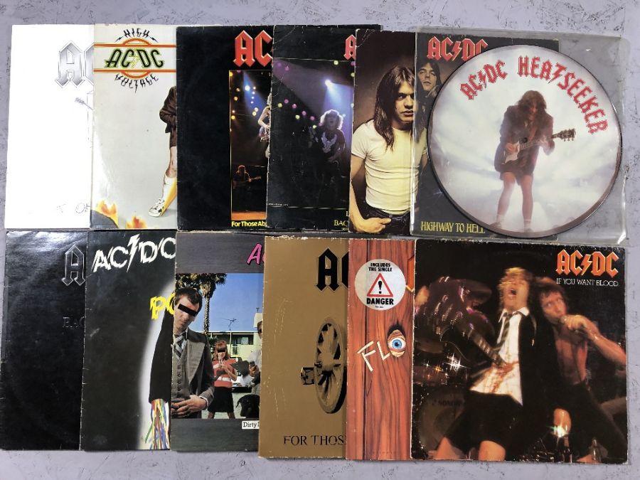 12 AC/DC LPs/12" including: "Heatseeker" (12" picture disc), "If You Want Blood", "Highway to Hell",