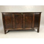 Large 16th / 17th Century oak coffer with four panels to front and hinged two plank lid, approx