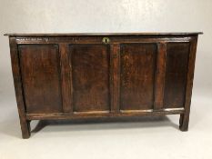 Large 16th / 17th Century oak coffer with four panels to front and hinged two plank lid, approx