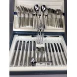 Boxed set of Villeroy and Boch stainless steel cutlery with chequered pattern to handles, 53 pieces,