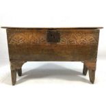 Small 17th Century oak plank coffer with single plank hinged lid, with carved detailing, approx