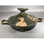 Greek Lekanis: Lidded bowl and plate on pedestal foot with two handles, painted clay with black