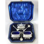 Silver Hallmarked Cruet set comprising Mustard and two salts with three spoons in presentation box