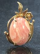 Highly polished Pink and white stone in unmarked gold metal mount (9ct)/ pendant marked D903.