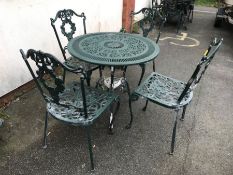 Green painted round garden table and four chairs, table approx 80cm in diameter