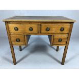 Small knee hole oak four drawer leather topped writing desk with circular handles, approx 92cm x