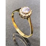9ct Gold Ring set with an Oval Aquamarine and sourrounded by Diamonds size approx 'O'