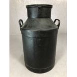 Vintage milk churn with lid and two handles, painted black, approx 58cm tall