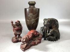 Collection of Chinese/ Eastern Curios to include a family of Elephants a lion etc....