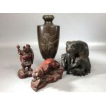 Collection of Chinese/ Eastern Curios to include a family of Elephants a lion etc....