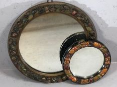 Two circular carved wooden framed mirrors the largest 41cm in diameter