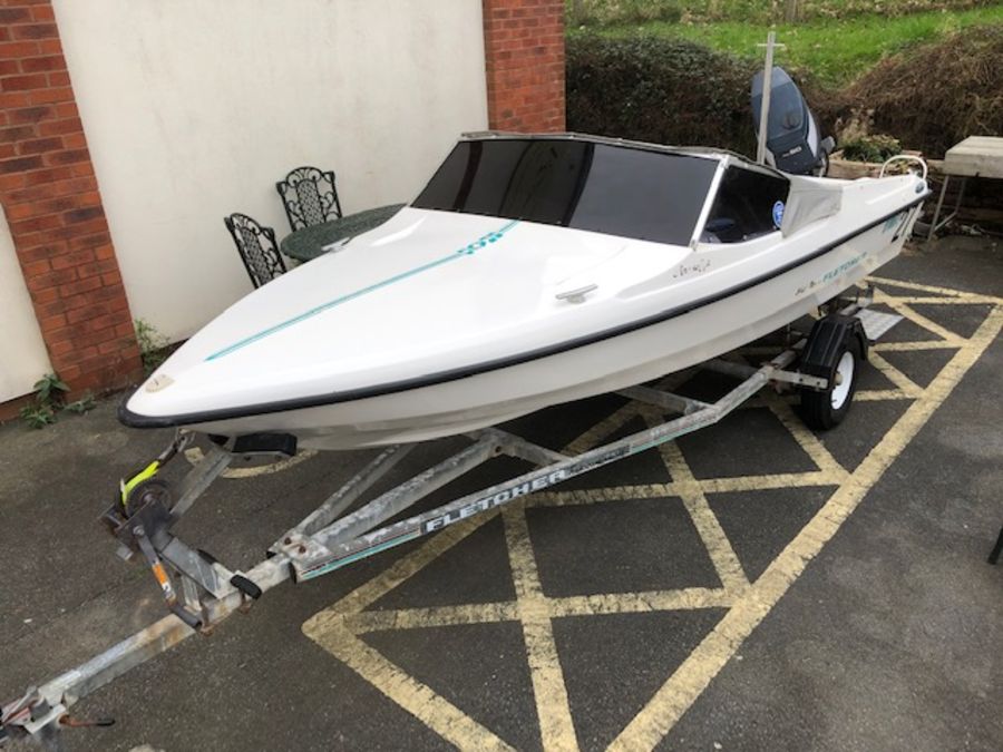 Speedboat: A Black Max Fletcher Speed boat on a road/ launch trailer with a YAMAHA 60HP outboard