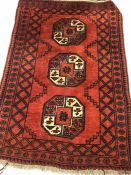 Small Eastern red ground rug, approx 150cm x 98cm