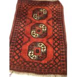 Small Eastern red ground rug, approx 150cm x 98cm