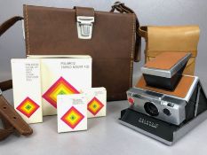 VINTAGE POLAROID SX-70 LAND CAMERA with tan leather coverings and original leather case and