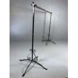 Garment / clothes rail on wrought iron decorative stands, pole approx 182cm in length and stands