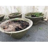 Three concrete garden pots