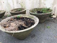 Three concrete garden pots