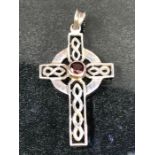 Silver marked 925 Celtic cross pendant set with central red stone approx 4 x 2.5cm