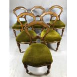 Set of six Victorian balloon back dining chairs on reeded front legs with green upholstered seats