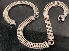 Silver marked 925 necklace in three sections with circular four row mesh design approx 40cm x 0.