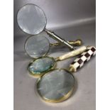 Collection of four magnifying glasses with decorative handles in varying designs, each approx 25cm