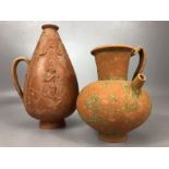 Two antique terracotta jugs, the smaller with internal strainer and pouring spout, the larger approx