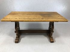 Oak coffee table of peg design with shaped end supports and cross stretcher, approx 91cm x 46cm x