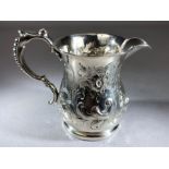 Victorian Hallmarked silver cream jug with repousse decoration and a beaded handle Birmingham 1877