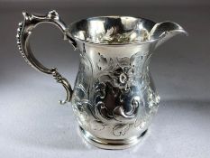 Victorian Hallmarked silver cream jug with repousse decoration and a beaded handle Birmingham 1877
