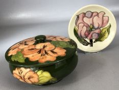 MOORCROFT lidded powder bowl in Hibiscus pattern on green ground, Queen Mary paper labels to base