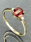 9ct Gold ring set with a red faceted Garnet Gemstone (approx 6mm in Diameter) size 'O'