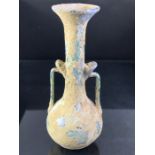 Small glass jug, possibly Roman, with two handles, approx 14cm in height
