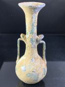 Small glass jug, possibly Roman, with two handles, approx 14cm in height