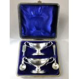 Silver hallmarked Birmingham twin handled salts on pedestal bases in velvet lined presentation