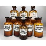 Collection of eight French vintage glass apothecary / chemist bottles with stoppers, the tallest