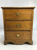 Light oak chest of three drawers with brass handles, approx 65cm x 39cm x 80cm tall