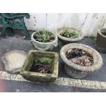Four concrete garden pots and a birdbath top
